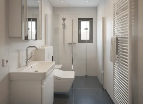 Ein schmal geschnittenes Badezimmer mit klar strukturierter Aufteilung: Waschplatz, WC und bodengleiche Dusche mit Glastür. Der dunkle Boden setzt sich von den hellen Wänden optisch ab.